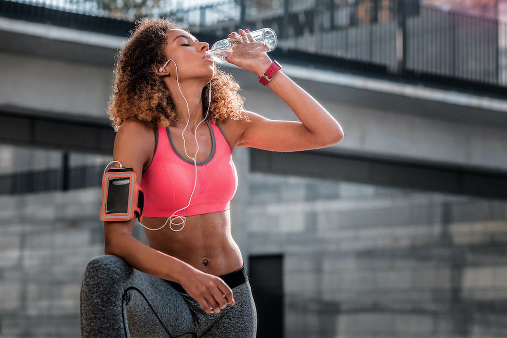 Women-drinking-water-during-outdoor-training.