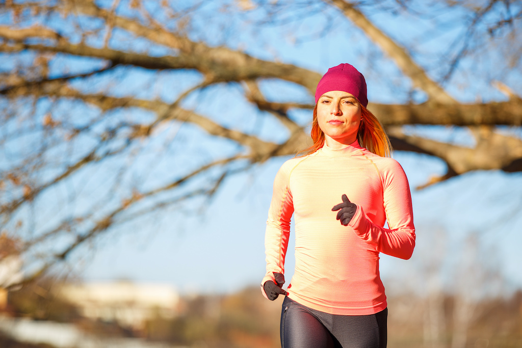 Outdoor Sport Exercises, Sporty Outfit Ideas. Woman Wearing Warm Sportswear  Running Jogging Outside During Winter. Stock Photo, Picture and Royalty  Free Image. Image 93192944.